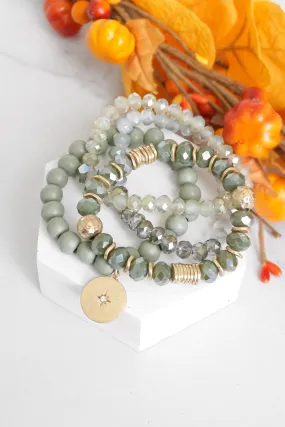 Beaded bracelets set in Olive green with a coin charm