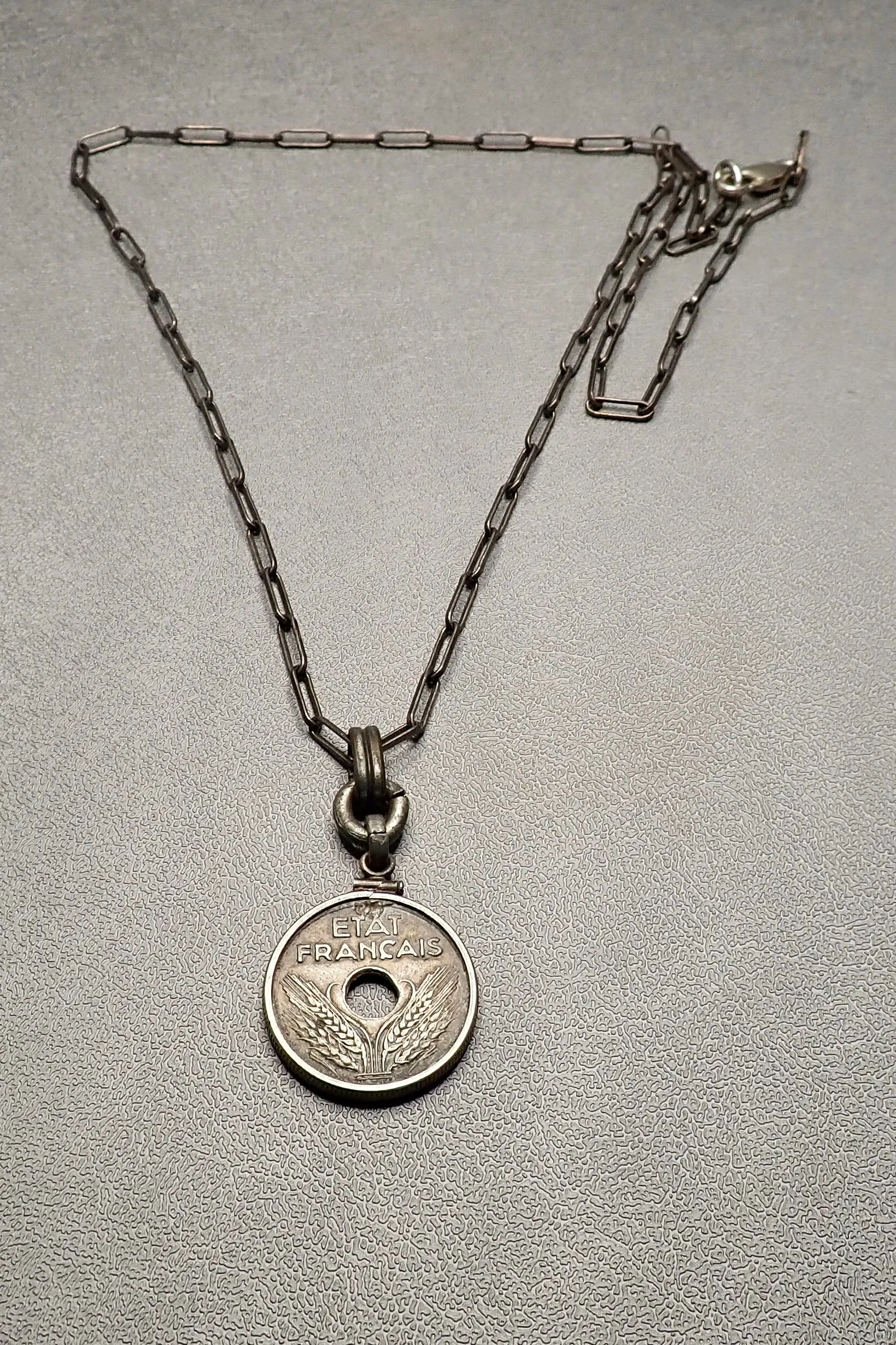 HOLE COIN PENDANT